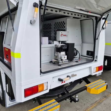 Image of the Battcom Electris Dricet Drive air compressor mounted in back of service vehicle.